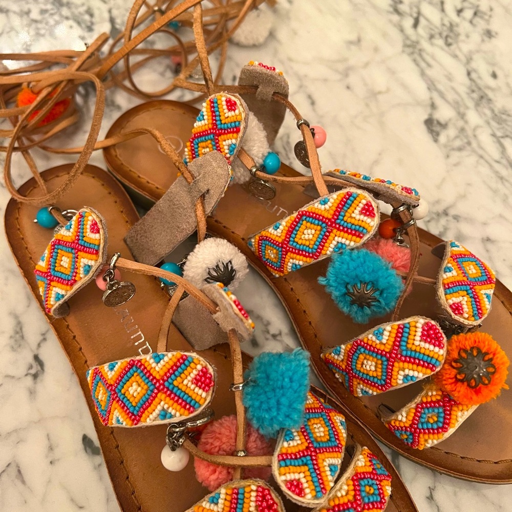 Gladiator sandals with pom poms by Chinese Laundry